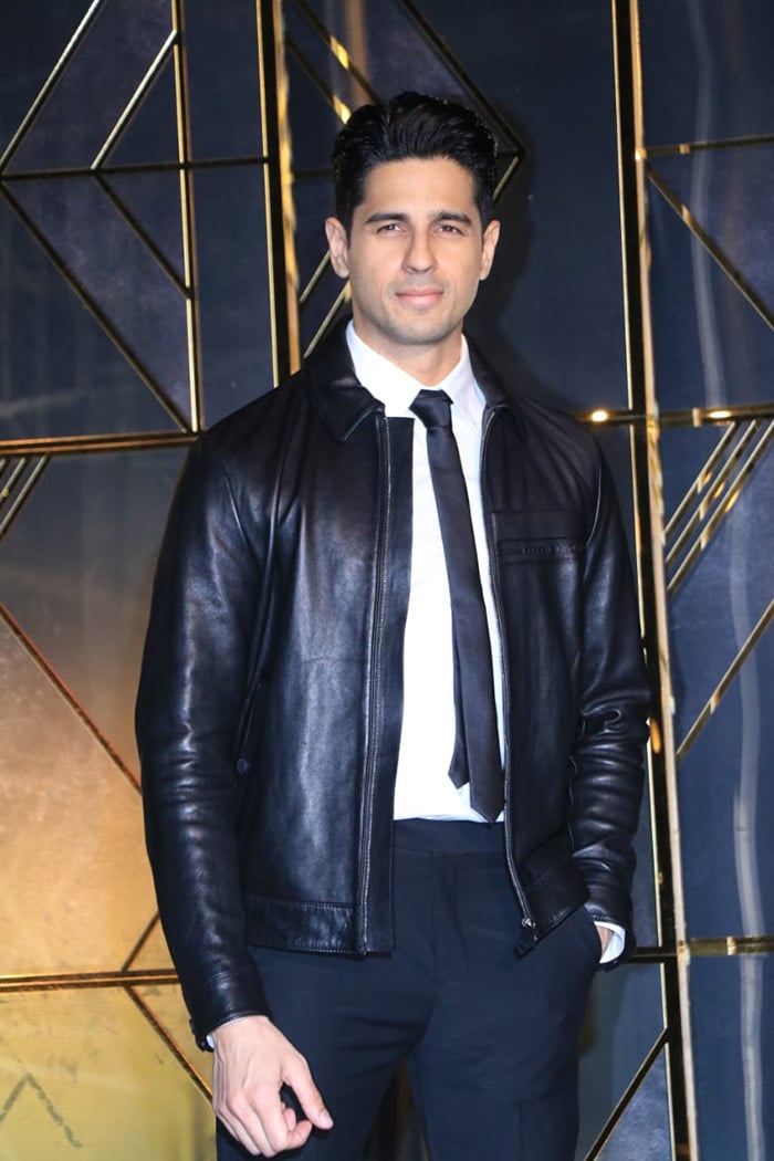 Sidharth Malhotra opted for a black jacket over formal attire.