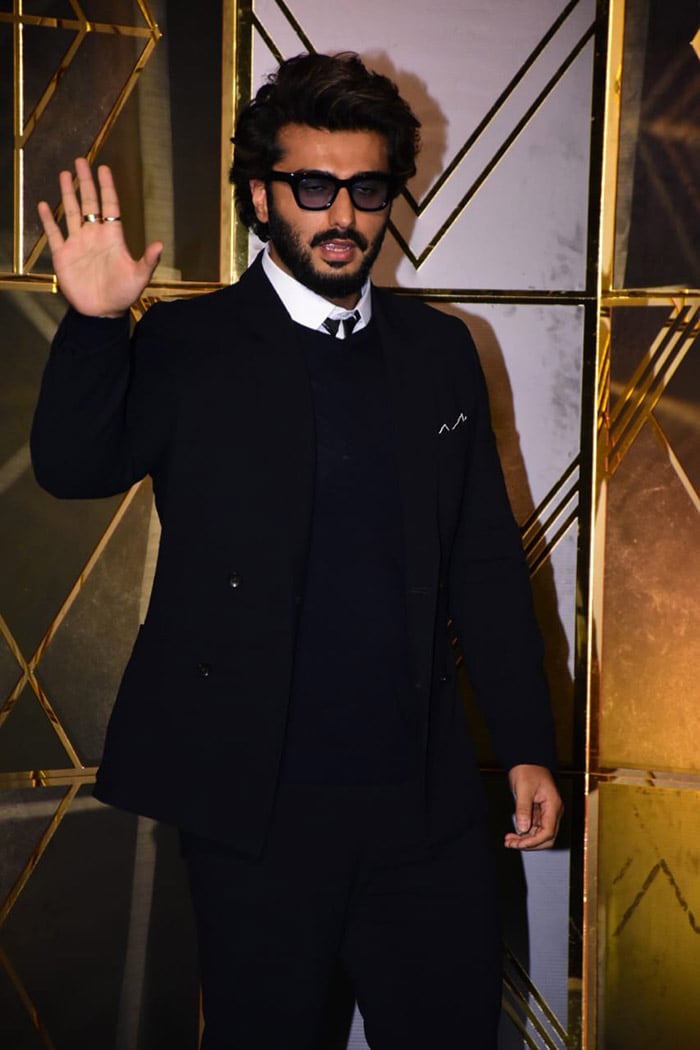 Arjun Kapoor waved at shutterbugs as he arrived at the event.