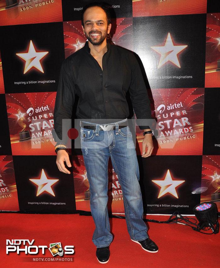 <i>Golmaal</i> director Rohit Shetty couldn't hold back his smile while posing for the cameras.