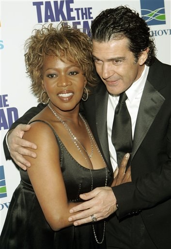 Actors Antonio Banderas and Alfre Woodard pose for photographers during arrivals for the world premiere of their film Take the Lead.