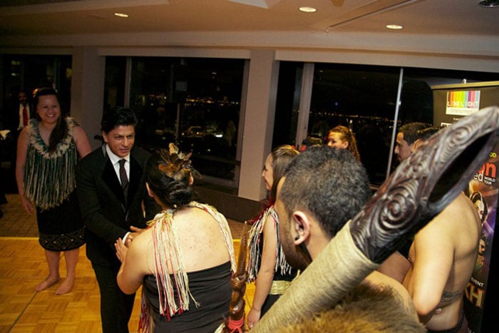 Shah Rukh greets the performers who put up a traditional dance for the actor.