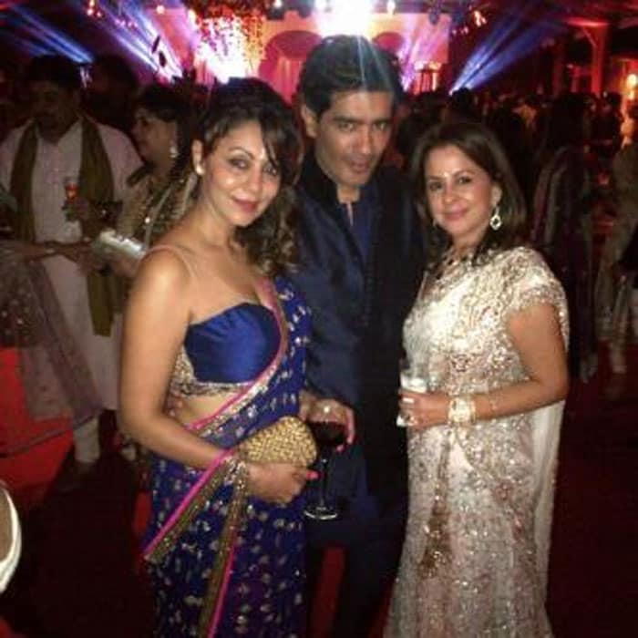 Gauri Khan looked beautiful in a blue and pink <i>sari</i> as she posed for a picture with designer Manish Malhotra and a friend.

(This picture was posted on Twitter by <a href="https://twitter.com/iamkhokha/status/390522968368881664/photo/1" class="@THESRKFC1">Taran Adarsh</a>)<br><br>

Ahead: Hurrah for SRK's <i>Circus</i> again