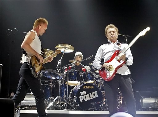 Members of the rock band The Police, from left, lead singer Sting, drummer Stewart Copeland and guitarist Andy Summers perform as the band kicks off their world tour in Vancouver.