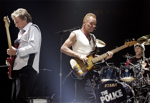 Andy Summers, left, Sting, center, and drummer Stewart Copeland perform during the start of the Police worldwide tour at GM Place in Vancouver.