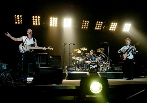 Members of the rock band The Police, from left, lead singer Sting, drummer Stewart Copeland and guitarist Andy Summers perform in Vancouver to kick off the bands world tour.