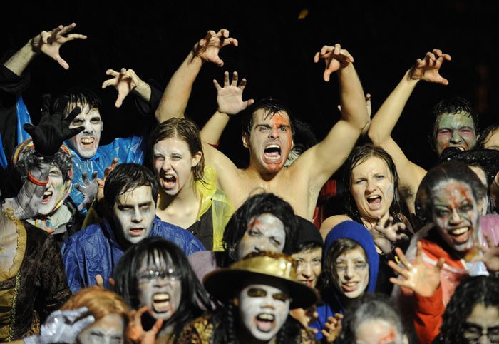 People dressed as 'zombies' pose before dancing to Michael Jackson's Thriller during &quot;Thrill The World: A Global Tribute to Michael Jackson&quot; in Astoria Park in the Queens section of New York. Groups of people around the world danced at 1230 GMT October 25 to the Thriller song. (Image: AFP)