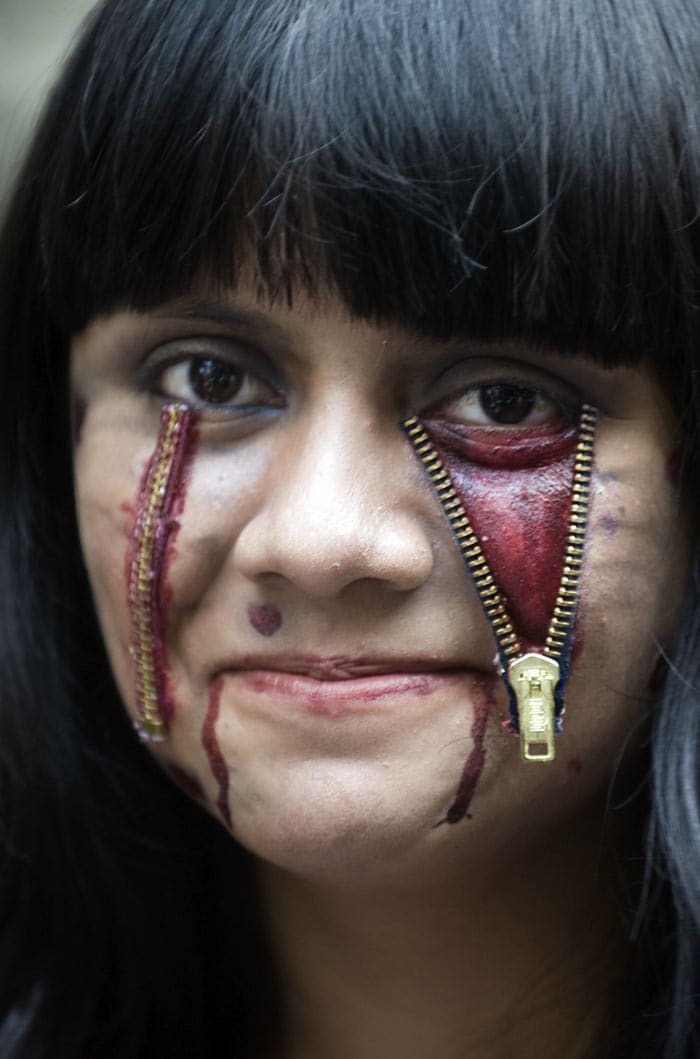 A Mexican girl dressed as a zombie poses for photographers during a rehearsal and just before the start of the &quot;Thrill The World: A Global Tribute to Michael Jackson&quot; in Mexico City. (Image: AFP)