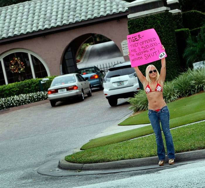 Woods, fiercely guarded about his private life, has been at the receiving end of jokes and gossip ever since the news of his bizarre accident broke. Here MJ Radio show personality Meredith Walusek is seen holding a sign that reads, "Tiger- They offered me $500,000- I?m keeping my mouth shut!", in front of a gate to the Isleworth community where Tiger Woods has a home on December 2, 2009 in Windermere, Florida. (Photo: AFP)