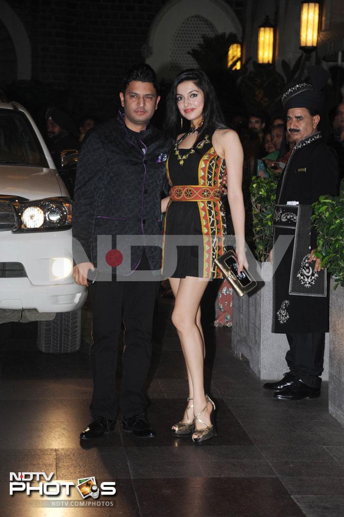 Bhushan Kumar poses with his wife Divya outside the venue.