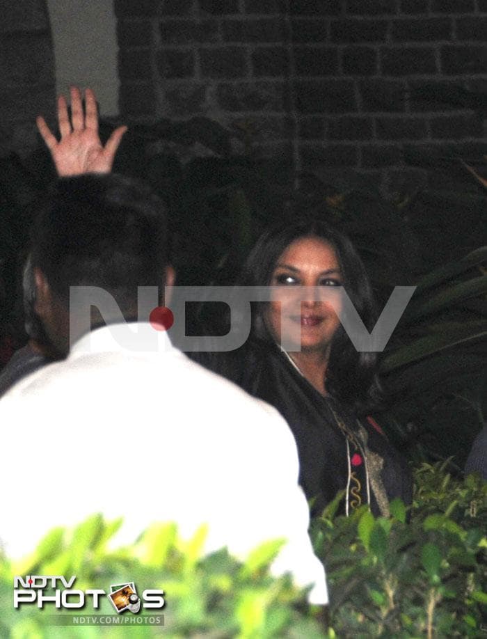 Shabana Azmi waves at the photographers.