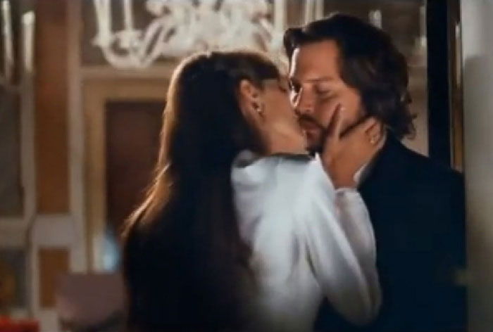 Romantically entwined, the two share an intimate kiss in <i>The Tourist</i>, as seen in the recently released trailer.