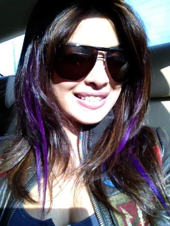 Priyanka Chopra tweeted her new look with purple highlights: "Boredom struck!! Got purple streaks... Say whaaaaaaaa?"