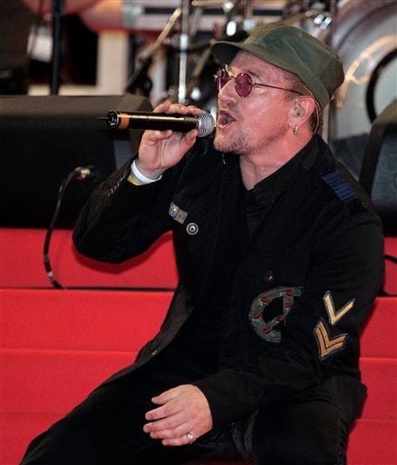 Bono of the band U2 performs before the screening of the film U2 3D, at the 60th International film festival in Cannes.