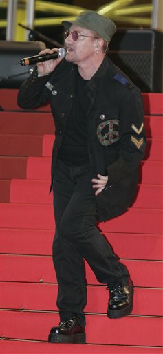 Bono of the band U2 sings before the screening of the film U2 3D, at the 60th International film festival in Cannes.