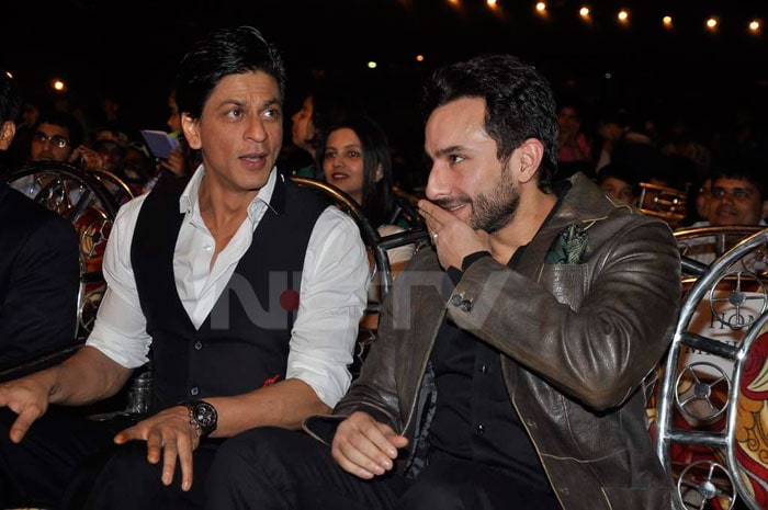 We caught the two Khans (Saif and SRK) sitting and gossiping.