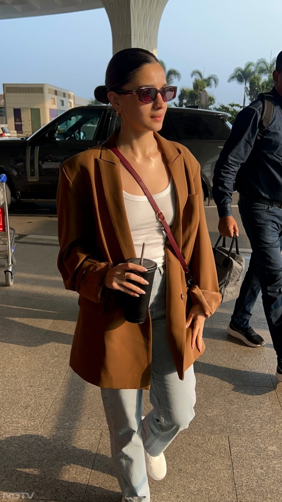 Alia  Bhatt wore denims and paired it with a brown coat. (Image Courtesy: Varinder Chawla)