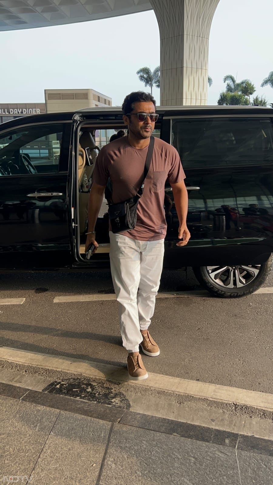 Suriya sported a brown t-shirt teaming it up with white pants. (Image Courtesy: Varinder Chawla)