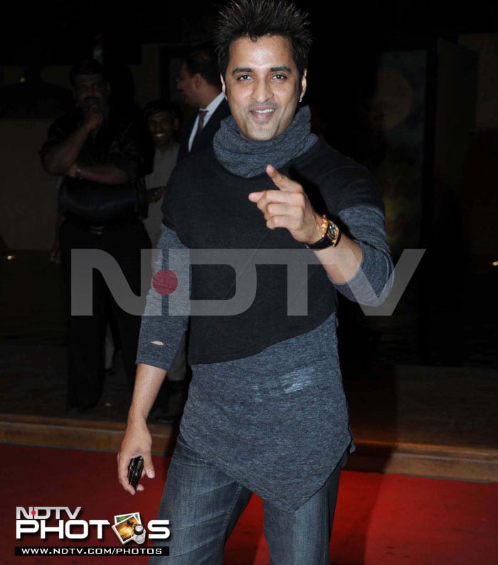 Choreographer Ganesh Hegde gestures at the photographers.