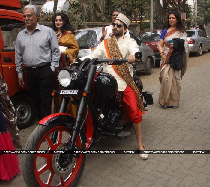 The bridegroom entered on a bike instead of the traditional horse.