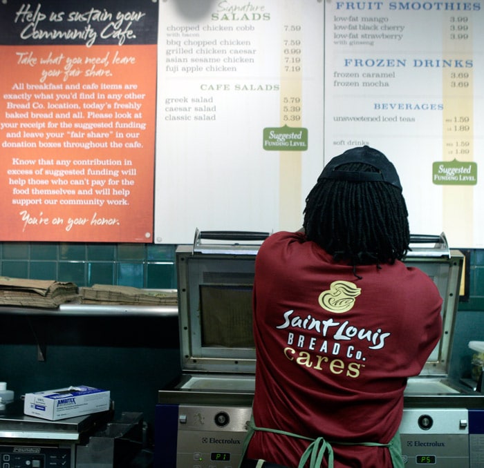 Employee Kevin Wilson works behind the counter at a Panera Bread Co. restaurant, on Tuesday, May 18, 2010, in Clayton, Mo. The national bakery and restaurant chain launched the new nonprofit store this week that has the same menu as its other locations. But customers are told to donate what they want for a meal, whether it's the full suggested price, a penny, or $100. (Photo: AP)