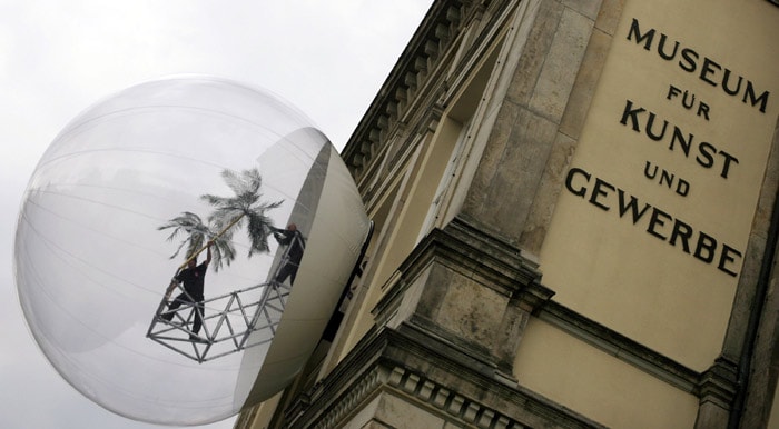 Workers set up the installation 'Oasis 7' by the Austrian artist group Haus-Rucker-Co on the frontage of the 'Museum fuer Kunst und Gewerbe' (Museum for Art and Industry) in Hamburg, northern Germany on May 17, 2010. The synthetic bubble with a diameter of seven metres can be explored during the exhibition 'Climate capsule. Survival Conditions during the disaster', taking place from May 28 to August 8, 2010. (Photo: AFP)