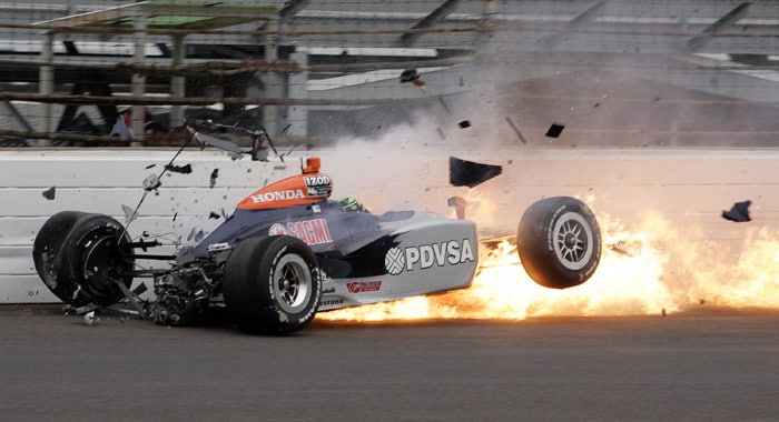 E.J. Viso, of Venezuela, hits the wall in the first turn during practice for the Indianapolis 500 auto race at Indianapolis Motor Speedway in Indianapolis, on Tuesday, May 18, 2010. (Photo: AP)