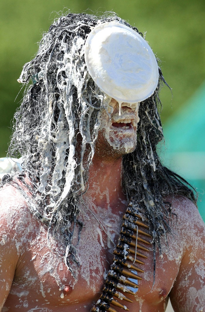 Joel Hicks of the Modern Family team from Leicester, England, in action during the annual World Custard Pie Championship held in Coxheath, England, on Saturday May 22, 2010. (Photo: AP)