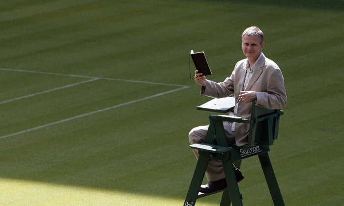 Matt Harvey the first Wimbledon tennis 'Championships Poet', sits in an umpire's chair as he poses for the cameras at Centre Court at Wimbledon, England, on Tuesday, May 18, 2010. The All England Club said on Tuesday that Harvey  will write a poem per day to sum up the matches and atmosphere of the the grass-court Grand Slam tournament. (Photo: AP)