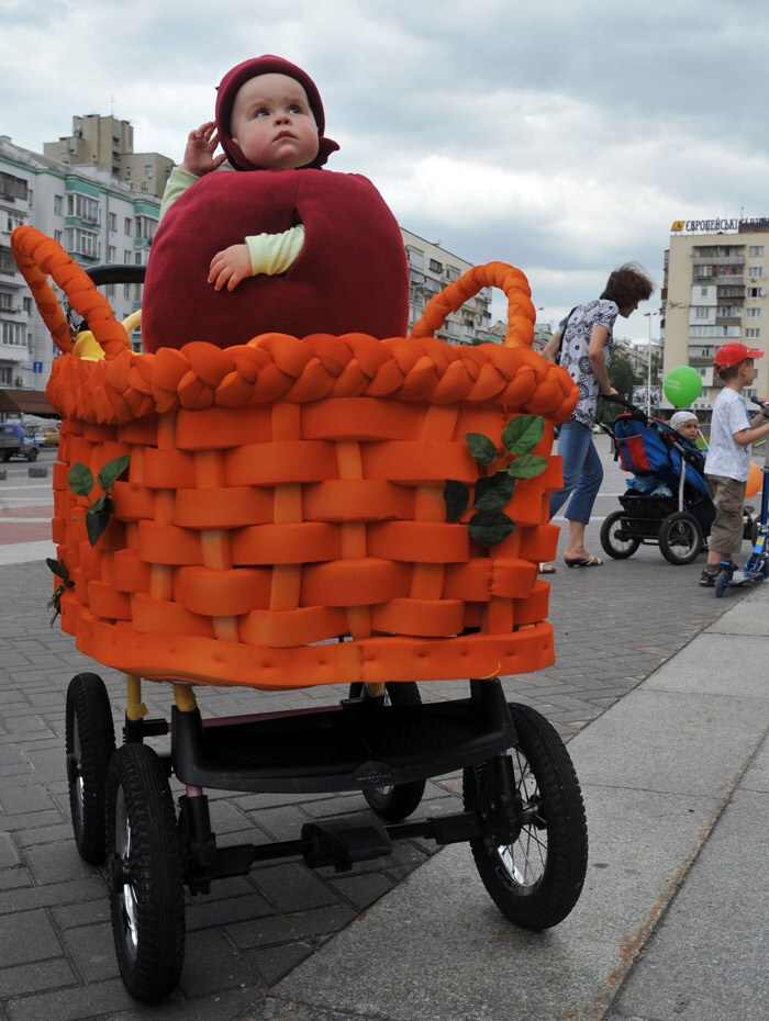 A baby sits in a hand-made pram during the First Festival of Prams in Kiev on May 21, 2010. (Photo: AFP)