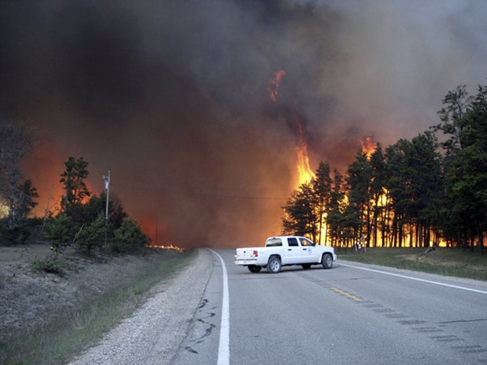 This Tuesday, May 18, 2010 photo released by the Michigan Department of Natural Resources and Environment shows the Meridian Boundary Fire near South Branch Township, Mich., in Crawford County. Crews continue to fight two forest fires in dry, windy northern Michigan, both of which have forced people to leave their homes. (Photo: AP Photo/Michigan Department of Natural Resources and Environment)