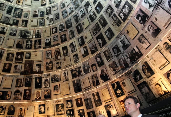 Croatian Foreign Minister Gordan Jandrokovic looks at pictures of Holocaust victims in the Hall of Names during a visit to the Yad Vashem Holocaust memorial in Jerusalem on May 17, 2010. The Yad Vashem Holocaust museum commemorates the six million Jews killed by the Nazis during World War II. (Photo: AFP)