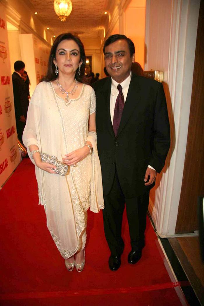 Nita Ambani also takes the traditional route in a white salwar kameez and shiny accessories.