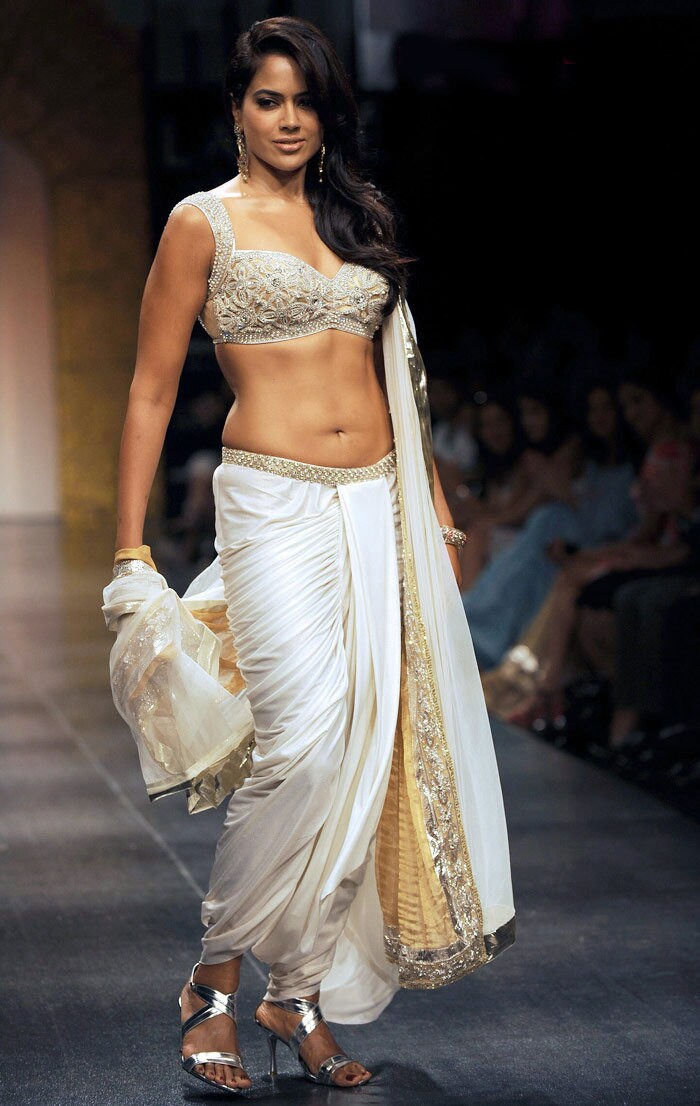 We cant get enough of Sameera Reddy's new curvy self in apsara-like white at Lakme Fashion Week.