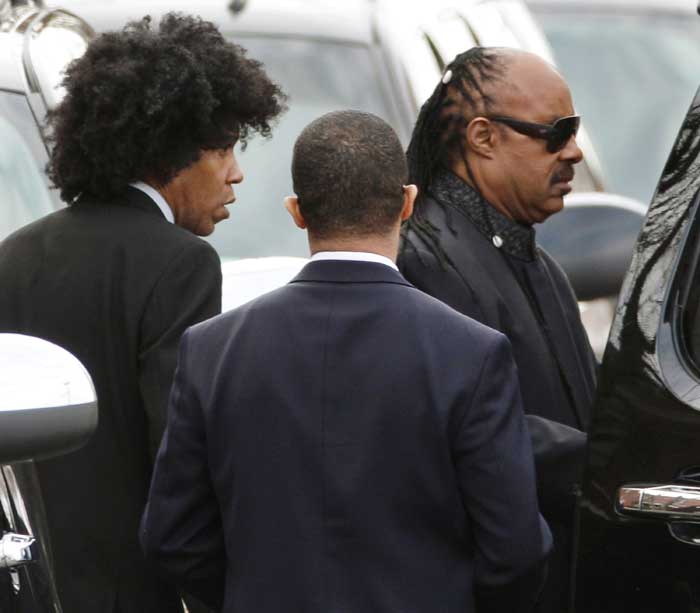 Singer Stevie Wonder, right, leaves the funeral service for Whitney Houston at New Hope Baptist Church in Newark, N.J.