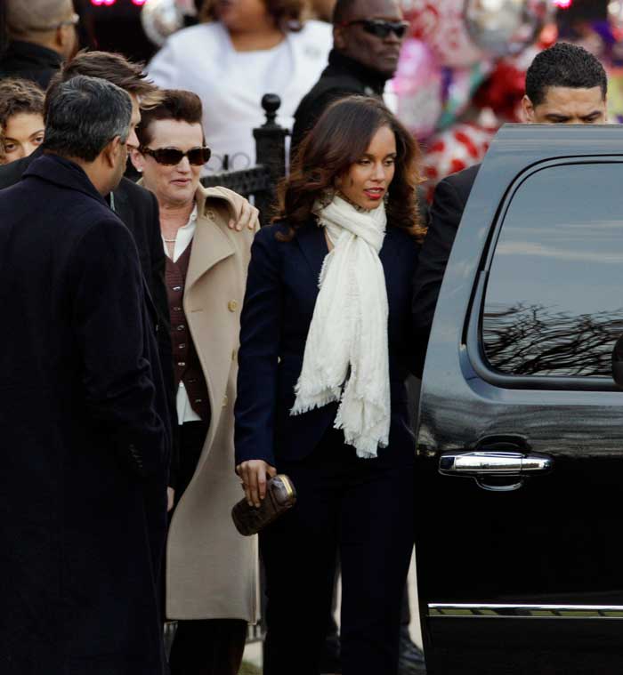 Singer Alicia Keys, center, leaves after a funeral service for Whitney Houston at New Hope Baptist Church in Newark, N.J.