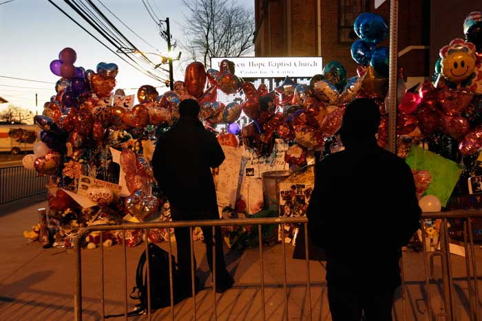 Fans gather at a memorial to Whitney Houston outside the New Hope Baptist Church.