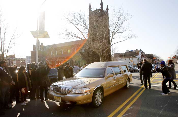 The hearse carrying the body of Whitney Houston leaves Whigham Funeral Home in Newark, N.J. for a short ride to the New Hope Baptist Church for her funeral.