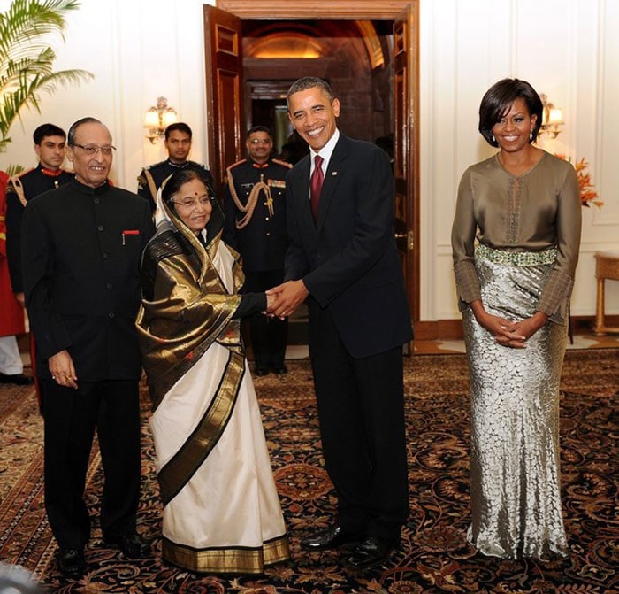 The First Lady of the United States may not have worked a saree but we think she more than made up in a floor length shiny skirt and blouse by Indian-American designer Rachel Roy.