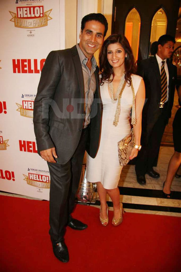 Twinkle Khanna loves her bandage dresses and they love her right back! She wore this white Herve Leger stunner at the Hello Magazine Hall of Fame Awards, accessorizing with gold accents and husband Akshay.