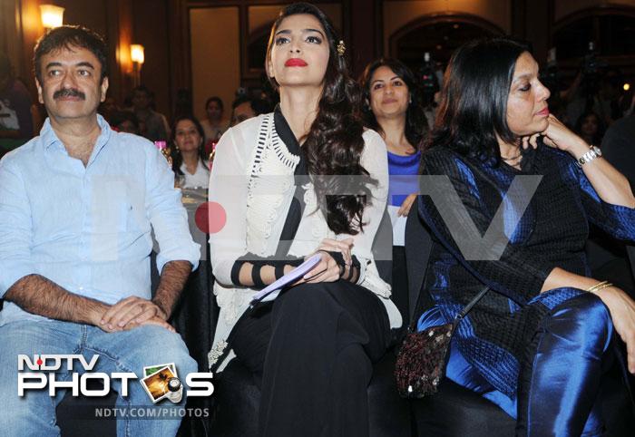 Director Raju Hirani, Sonam Kapoor and Mira Nair listen to the speaker.