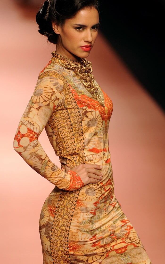 A model presents a creation by designers Ashima-Leena during the Wills India Fashion Week Autumn-Winter 2010 in New Delhi on March 25, 2010. India's leading fashion week event opened March 25 after a missing fire permit forced the cancellation of all shows on the first day. (Photos: AFP)