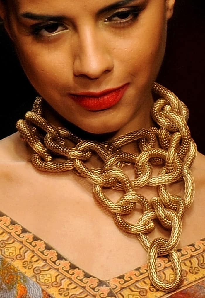 A model presents a creation by designers Ashima-Leena during the Wills India Fashion Week Autumn-Winter 2010 in New Delhi on March 25, 2010. India's leading fashion week event opened March 25 after a missing fire permit forced the cancellation of all shows on the first day. (Photos: AFP)