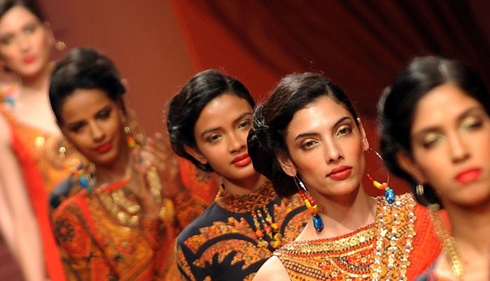 A model presents a creation by designers Ashima-Leena during the Wills India Fashion Week Autumn-Winter 2010 in New Delhi on March 25, 2010. India's leading fashion week event opened March 25 after a missing fire permit forced the cancellation of all shows on the first day. (Photos: AFP)