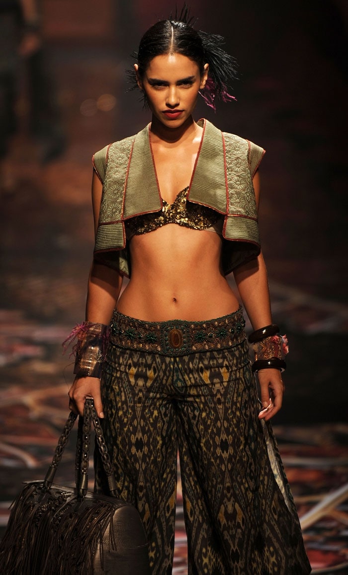 A model presents a creation by Indian designer Tarun Tahiliani during the Wills India Fashion Week in New Delhi on March 25, 2010.