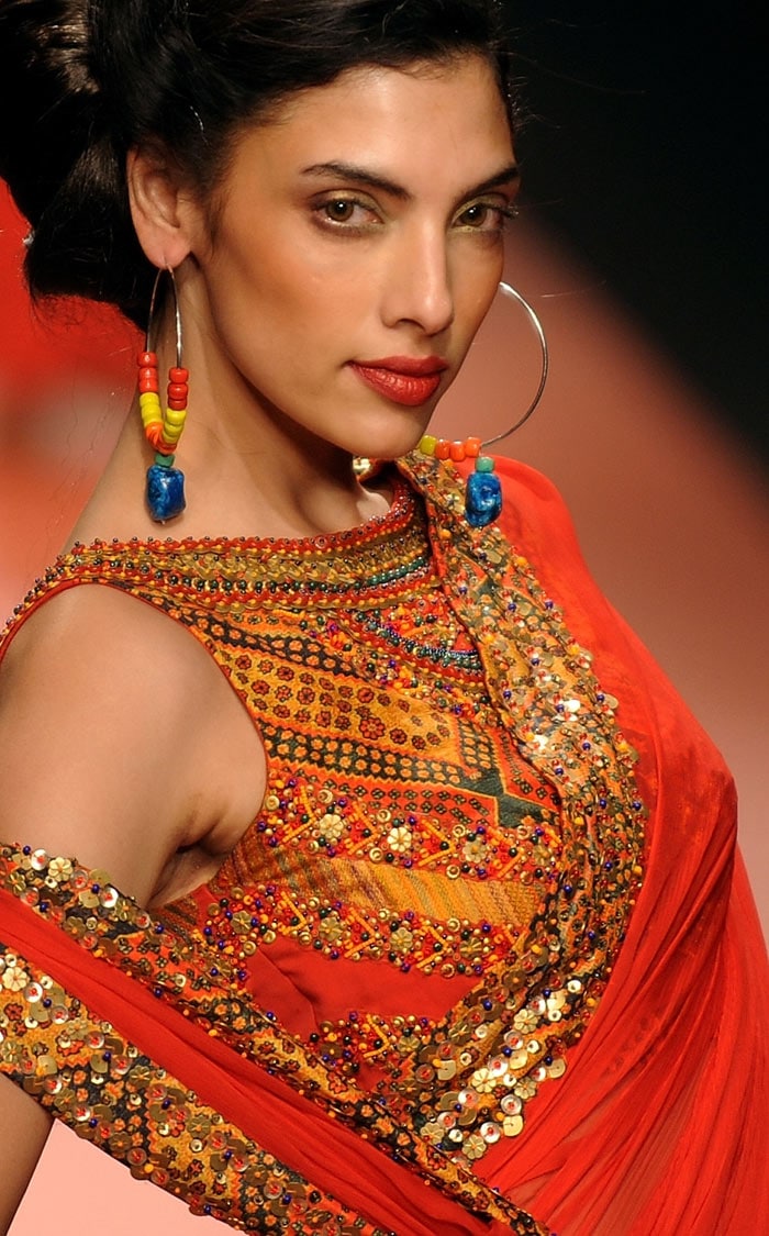 A model presents a creation by designers Ashima-Leena during the Wills India Fashion Week Autumn-Winter 2010 in New Delhi on March 25, 2010. India's leading fashion week event opened March 25 after a missing fire permit forced the cancellation of all shows on the first day. (Photos: AFP)