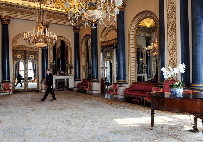 Palace Steward Nigel McEvoy, walks through the Music Room.