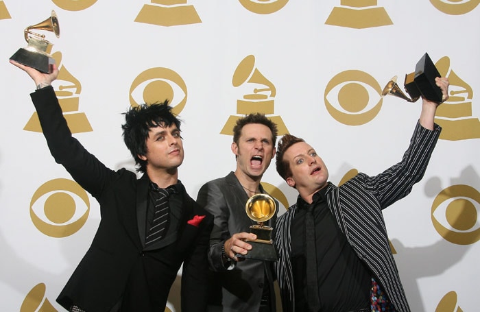 Green Day pose with their awards at the 52nd annual Grammy Awards in Los Angeles on January 31, 2010. (Photo: AFP)