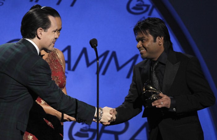 A.R. Rahman, right, is presented with the award for best song written for motion picture, television or other visual media at the Grammy Awards on Sunday, Jan. 31, 2010, in Los Angeles. (Photo: AP)