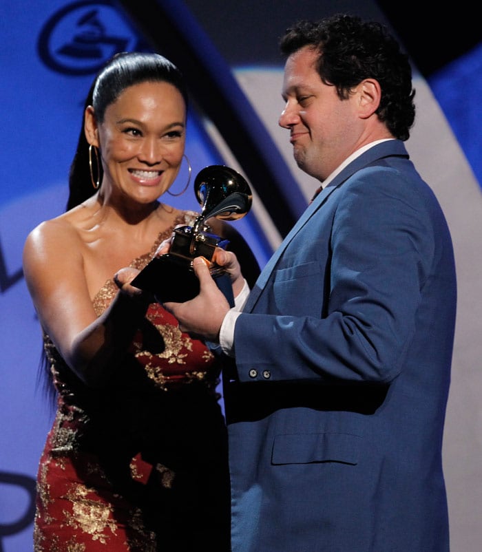 Tia Carrere, left,  presents Michael Giacchino with the award for best score soundtrack album for "UP" at the Grammy Awards on Sunday, Jan. 31, 2010, in Los Angeles. (Photo: AP)