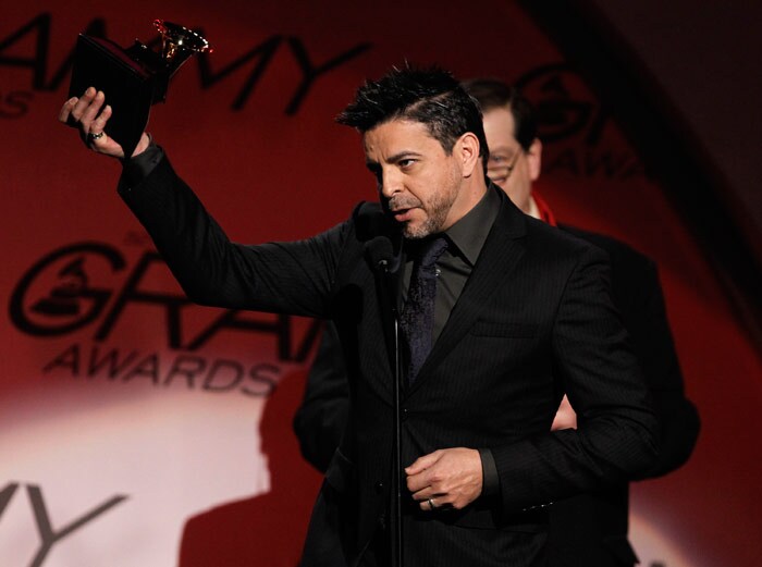 Luis Enrique accepts the award for best tropical latin album for "Ciclos" at the Grammy Awards on Sunday, Jan. 31, 2010, in Los Angeles. (Photo: AP)